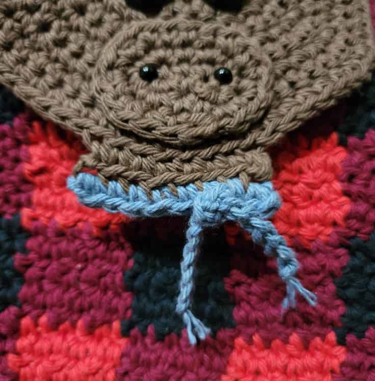 Light blue crochet scarf crocheted onto the moose neck.
