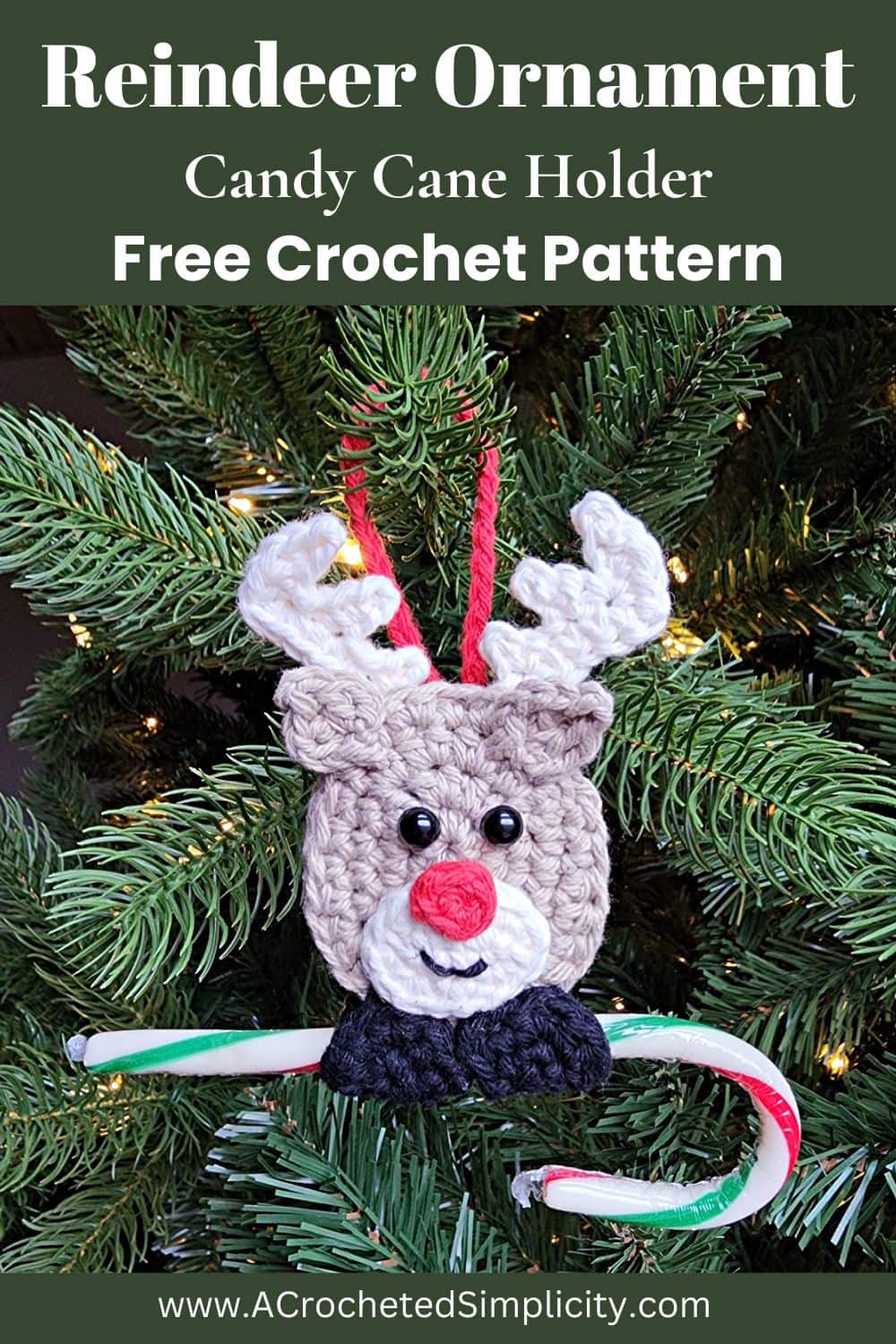 Crochet reindeer candy cane holder hanging on a tree holding a candy cane.