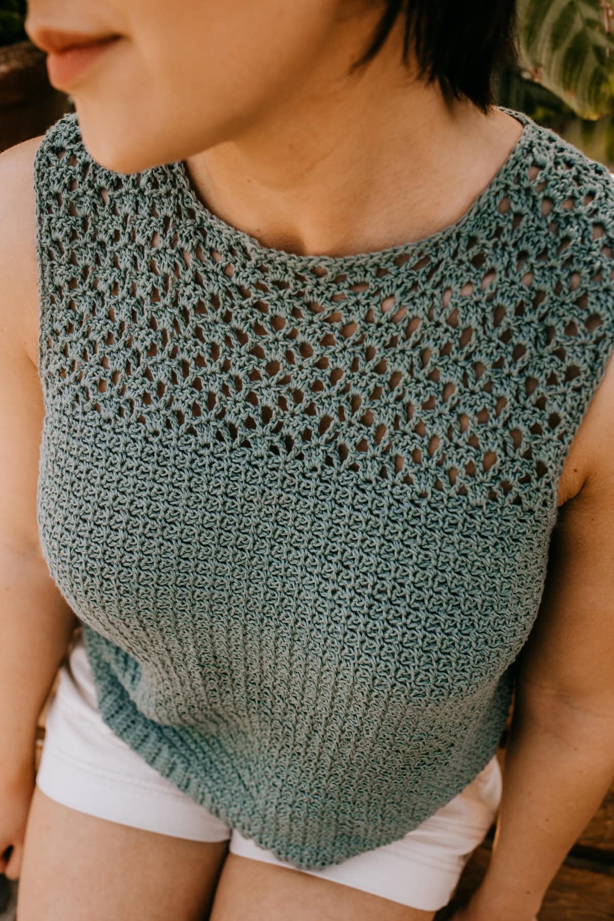 A close-up of the lace on a crochet summer top.