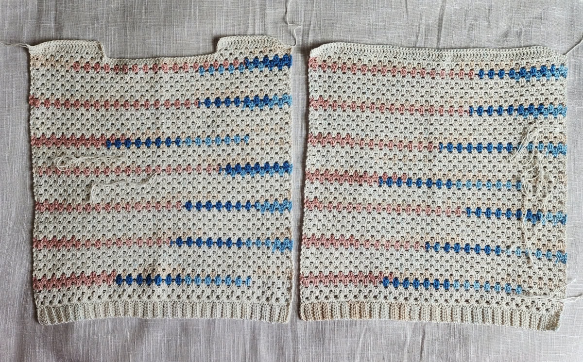 Front and back panels of a girls crochet top.