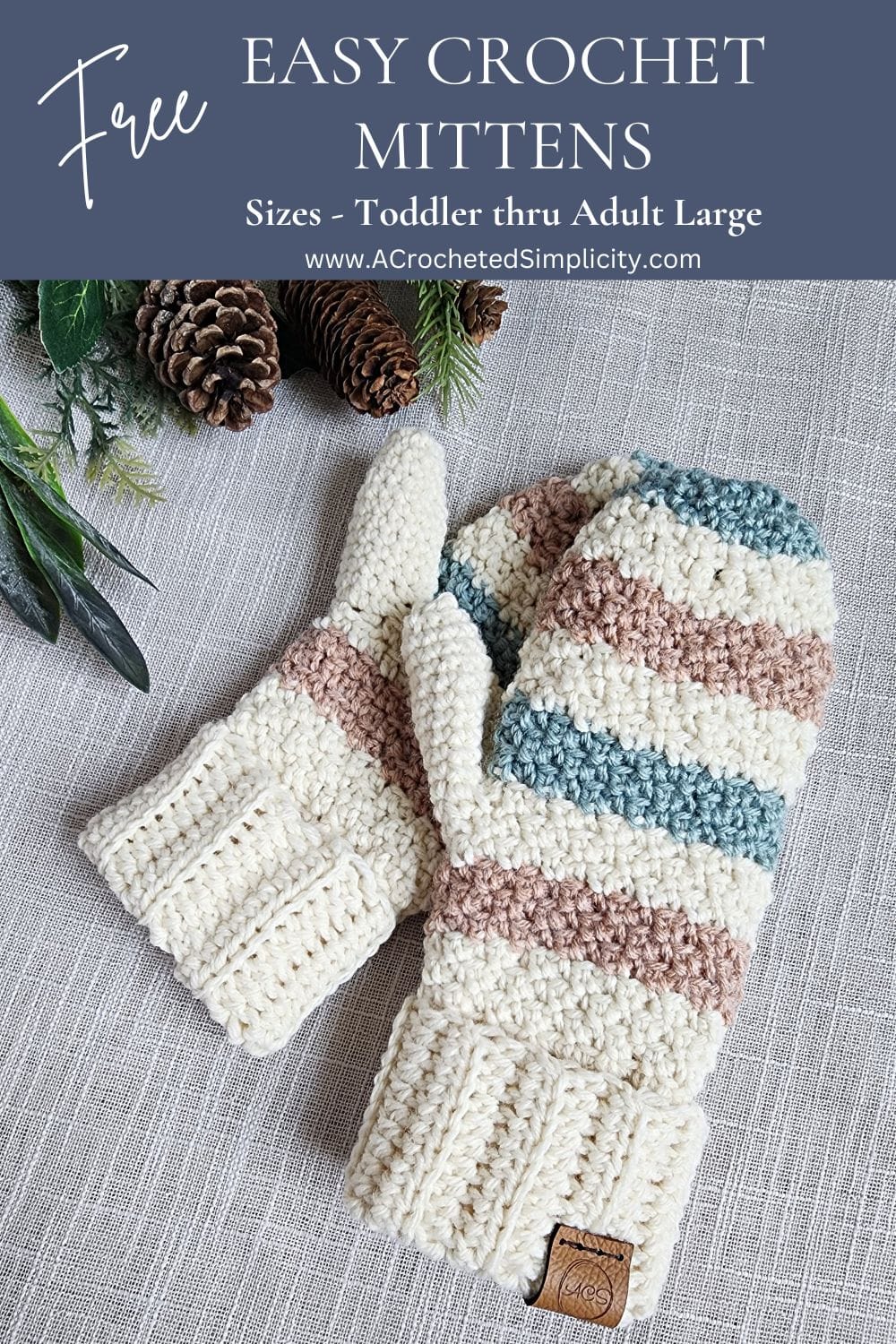 Cream, aqua, and salmon colored mittens laying next to pine cones.