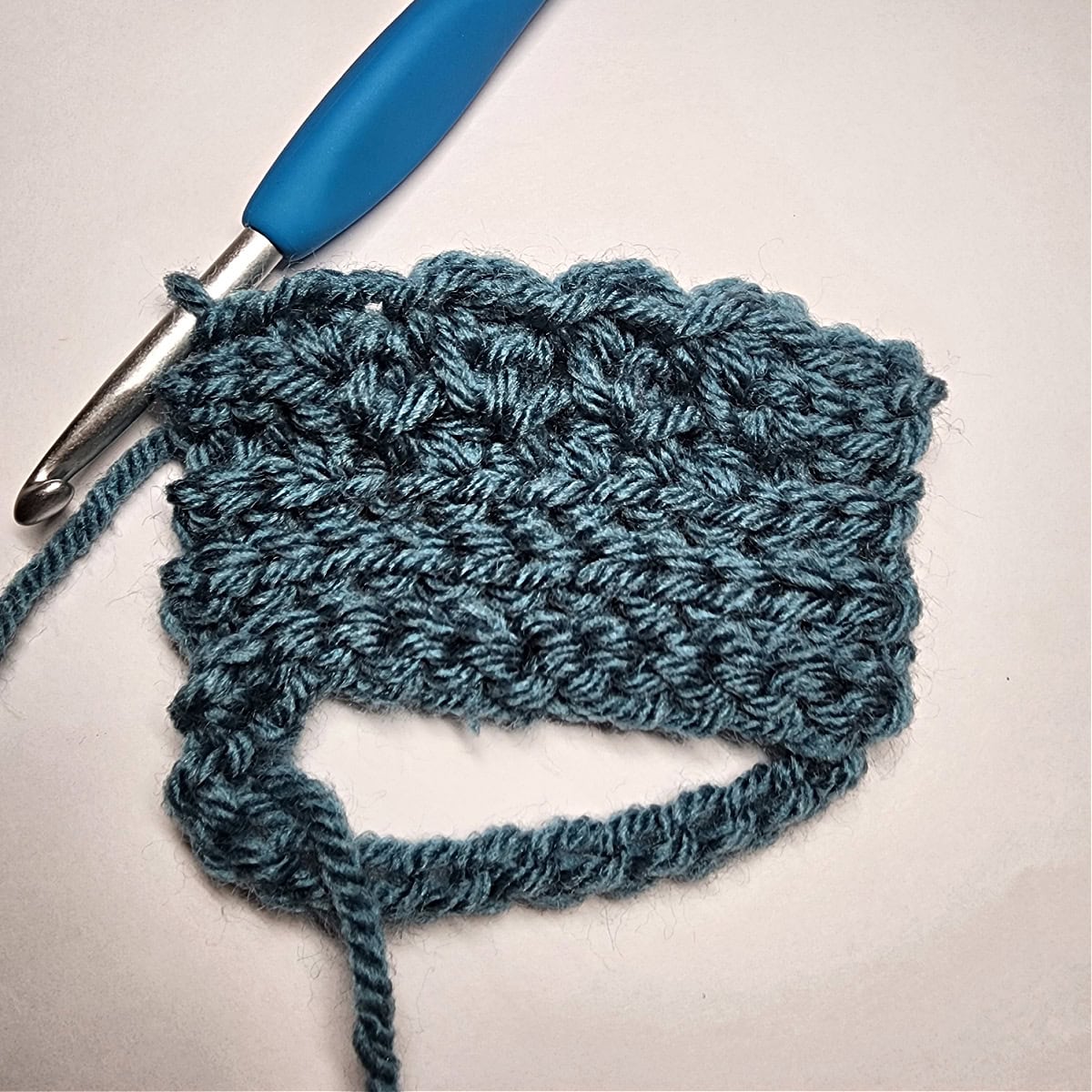 Five rows of slip stitch ribbing and four rows of the crunch stitch.