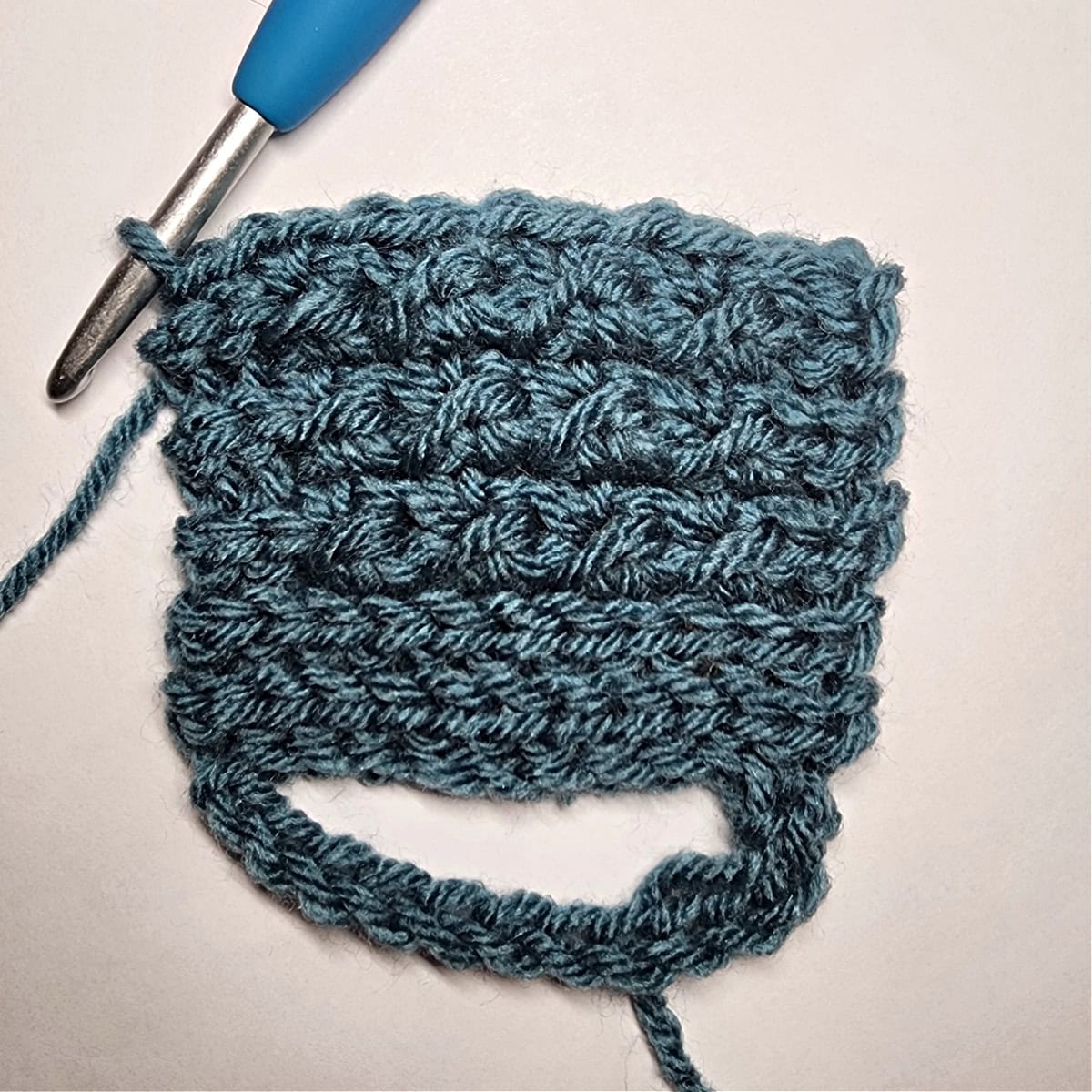 Six rows of crochet crunch stitch pattern.