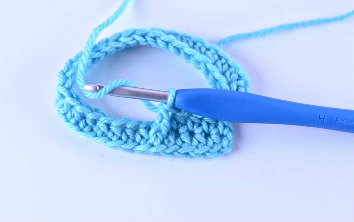 A front post double crochet stitch worked around the post of the next stitch.