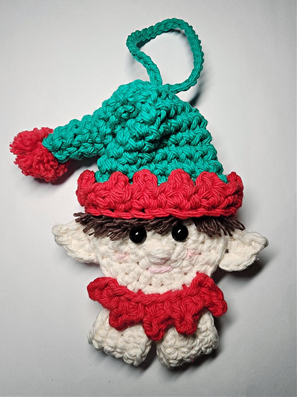 Elf crochet candy cane holder ornament complete with a hanging loop.