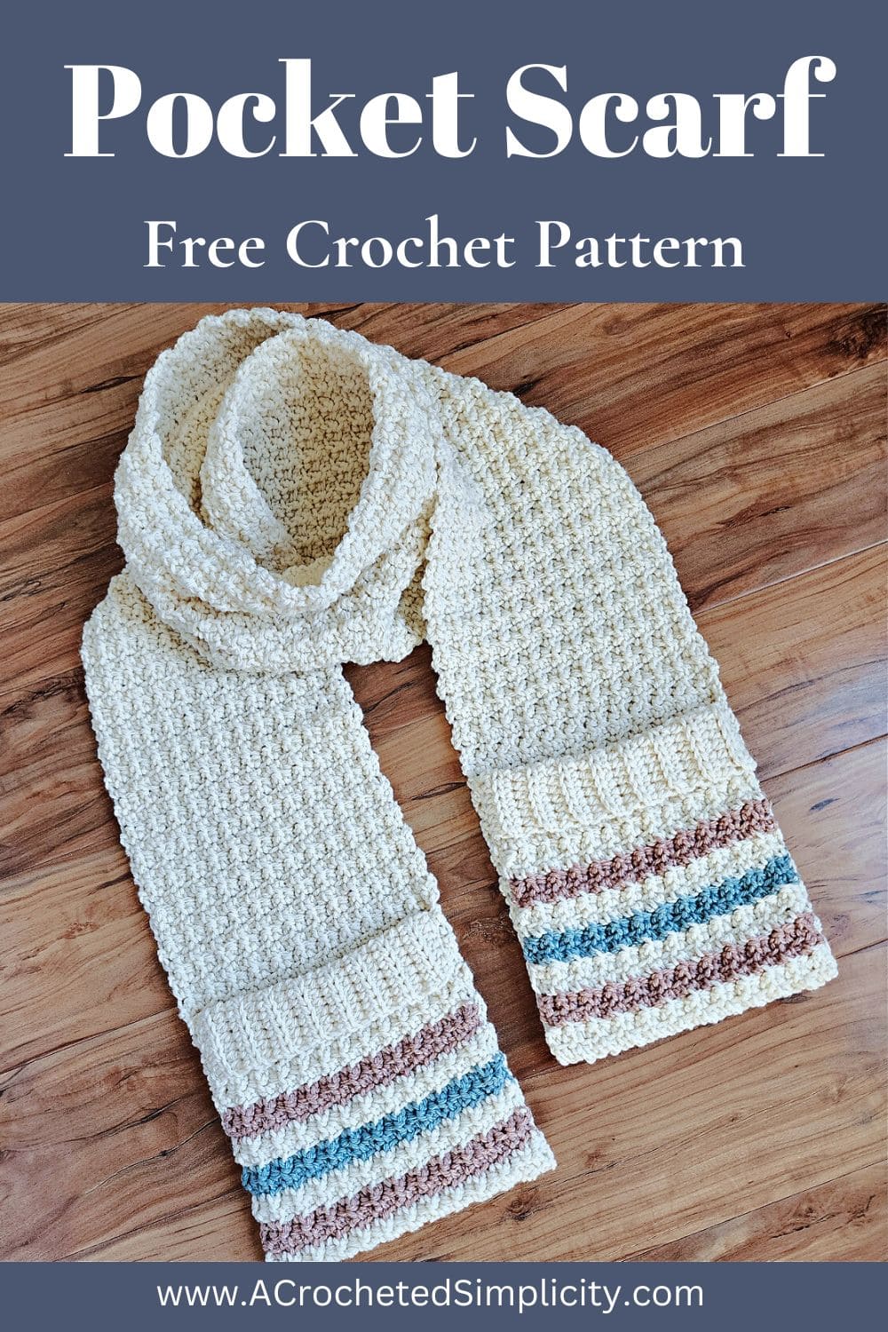 A crochet pocket scarf laying on a wood surface just like it would be worn around your neck.