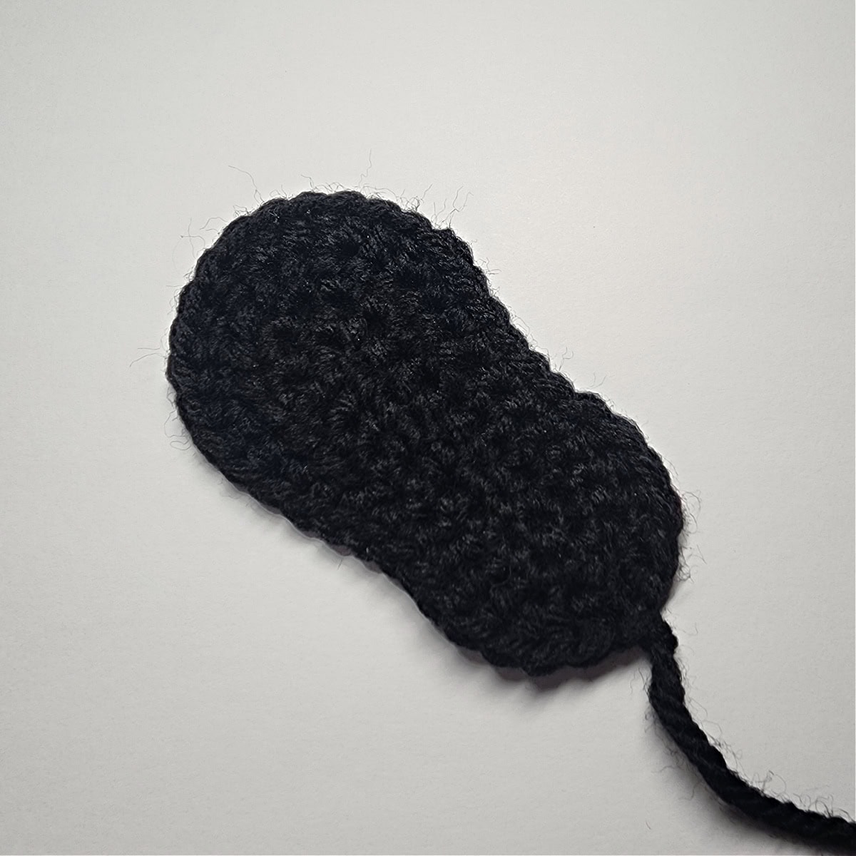 Small black crochet sole.