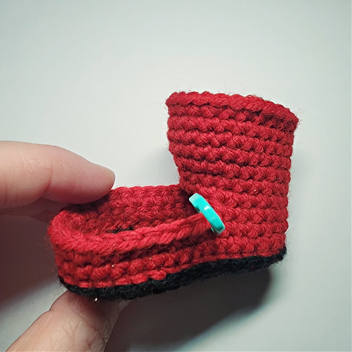 Black sole and red ankle portion complete for a Santa boot ornament.