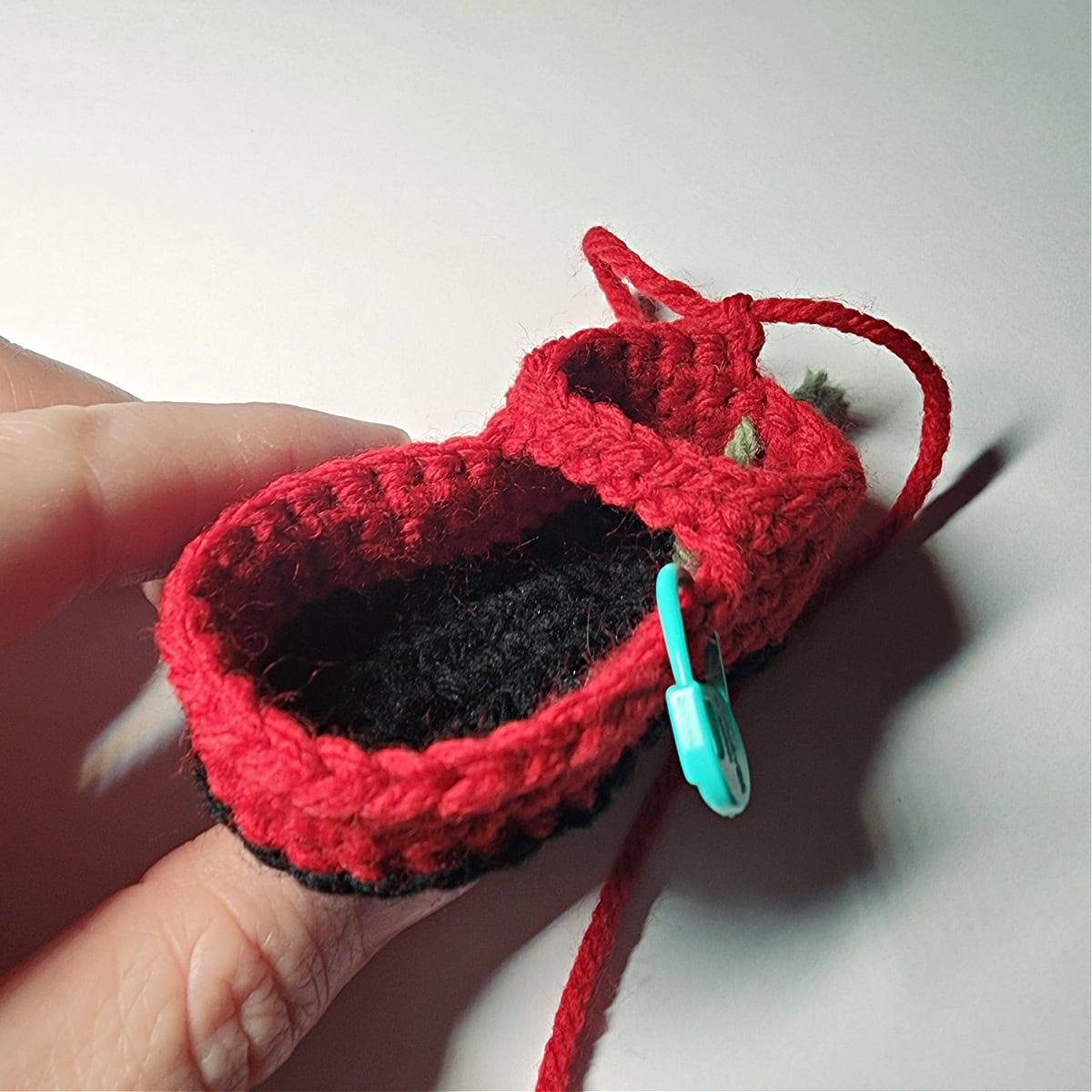 The beginning of the ankle of a crochet boot ornament.