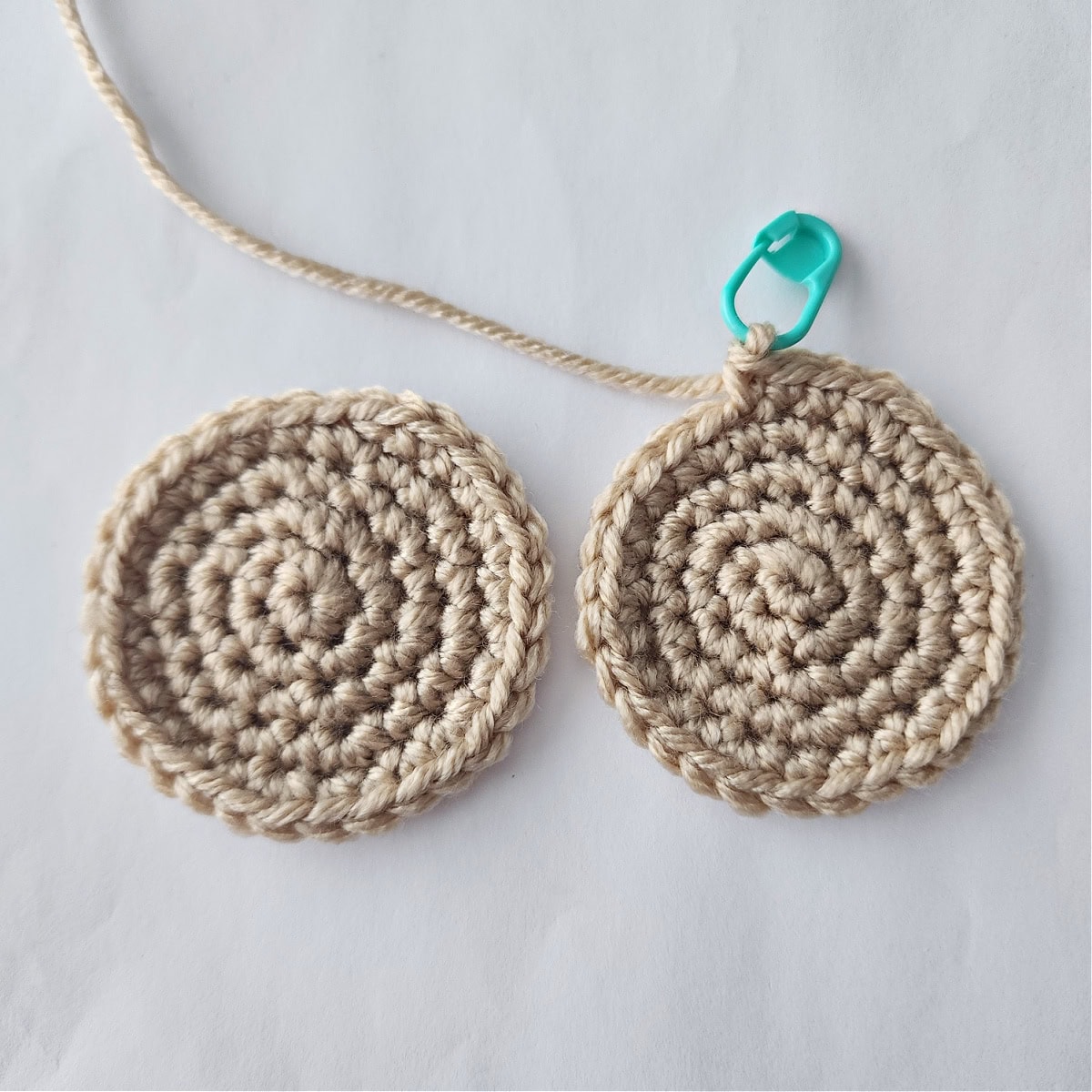 Two brown circles that will be joined to create a crochet chocolate chip cookie.