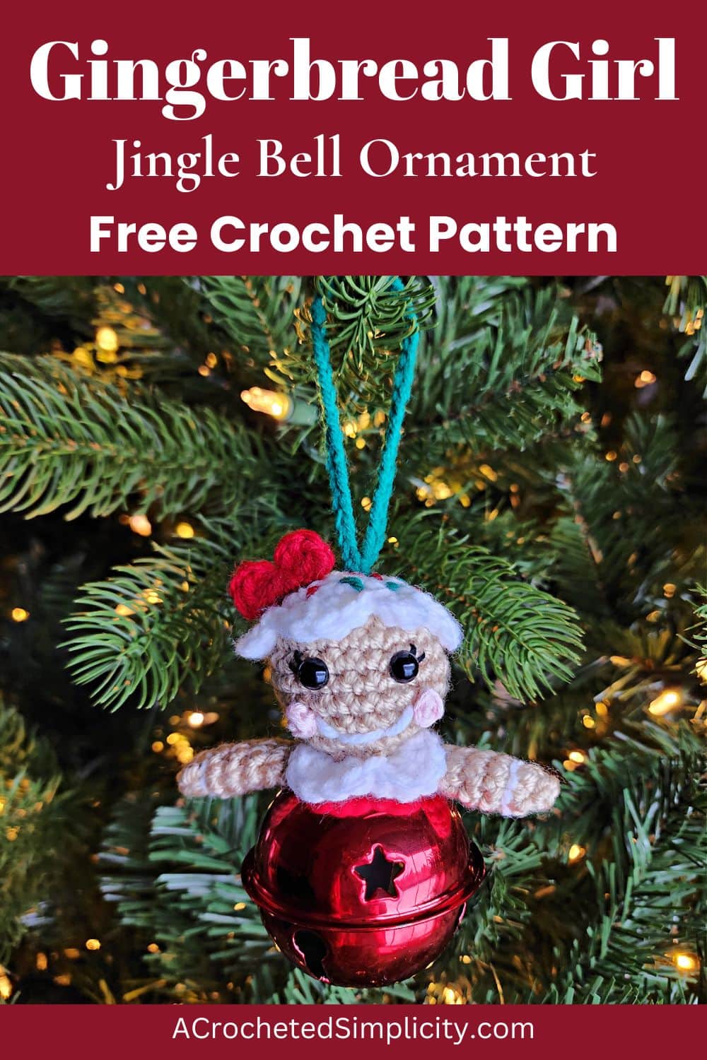 A crochet gingerbread girl jingle bell ornament with a red shiny bell hanging on a pre-it Christmas tree.