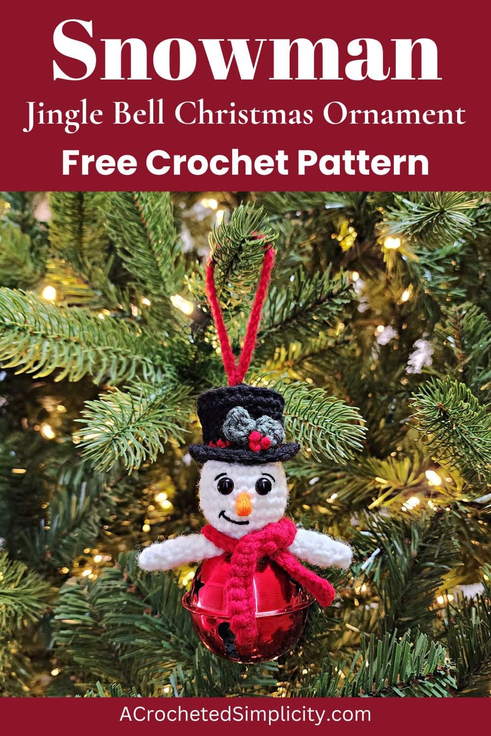 Crochet snowman ornament hanging on a pre-lit tree.