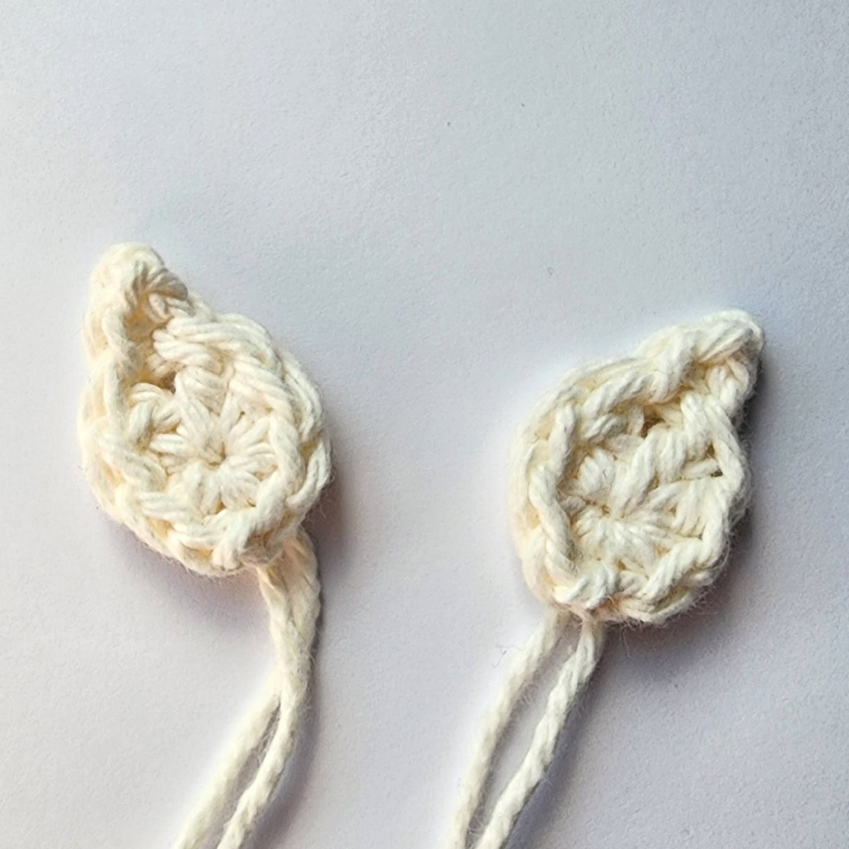 Two cream color crochet elf ears.