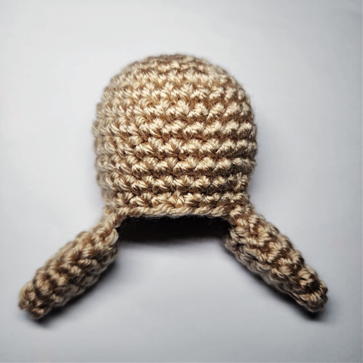 Plain brown crochet gingerbread body for an ornament.