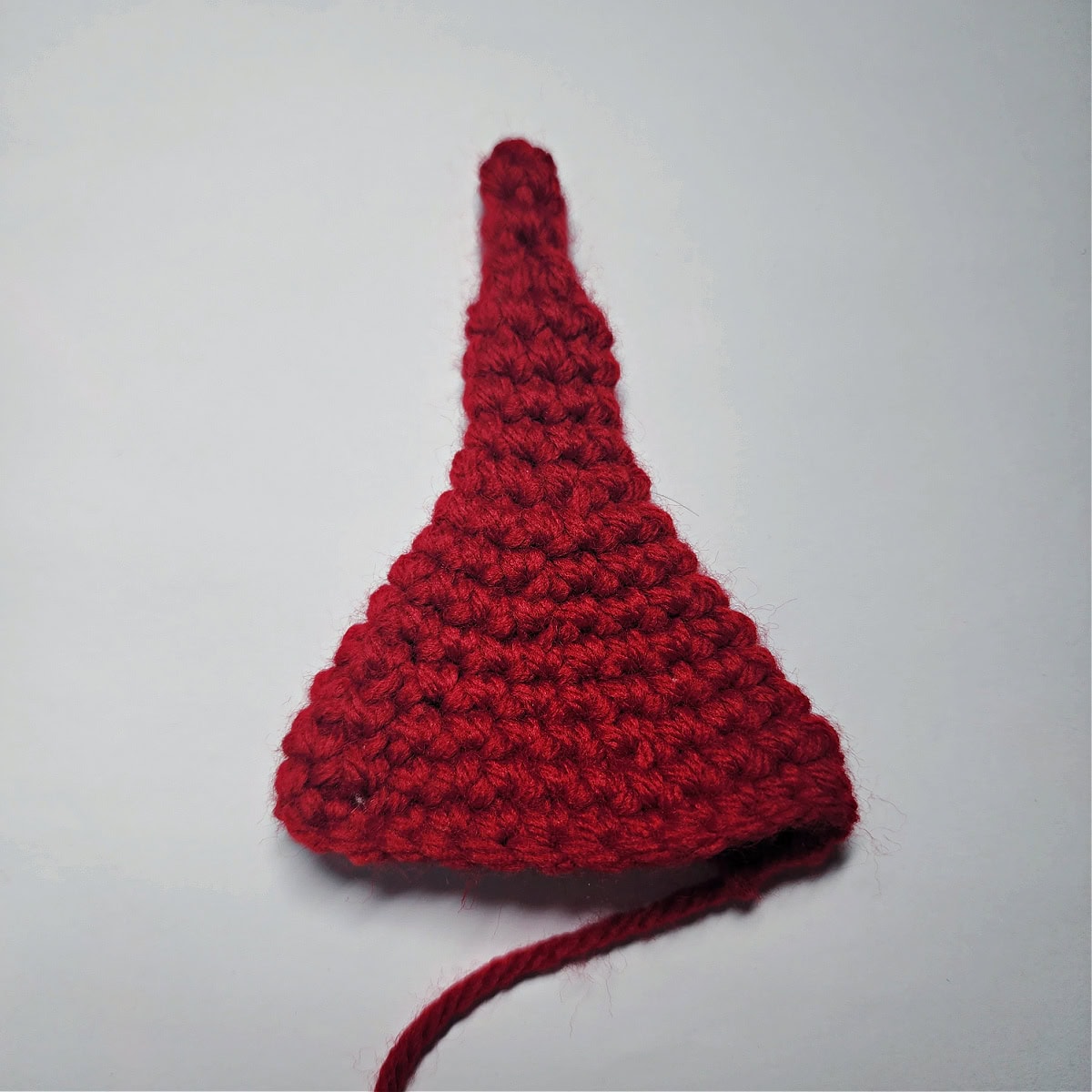 Small red crochet elf hat.