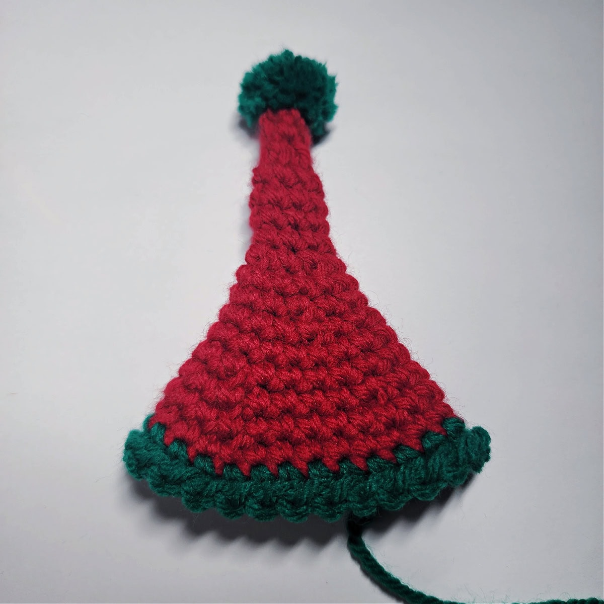 Red and green crochet elf hat is complete.