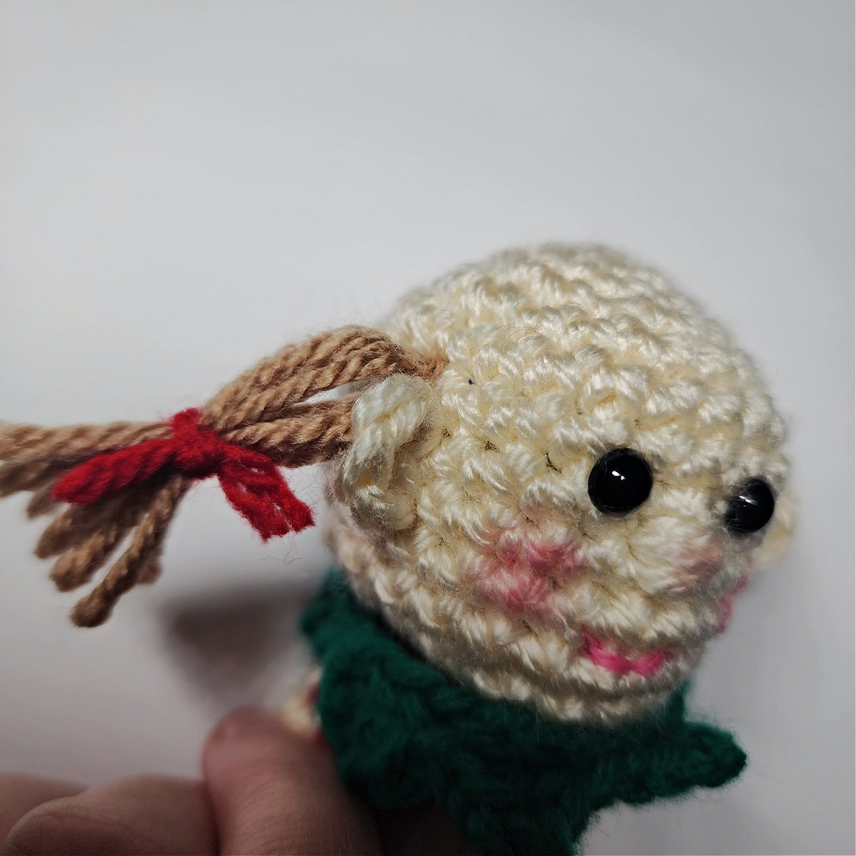 How to attach hair to girl crochet elf ornament.