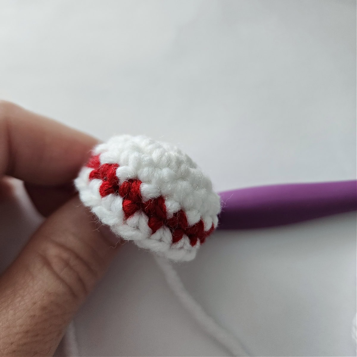 Small white bun with a skinny red stripe for the top of Mrs Claus's hair.