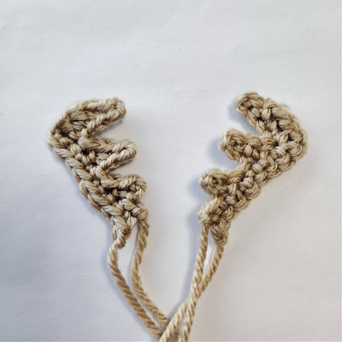 Light brown crochet antlers for reindeer.