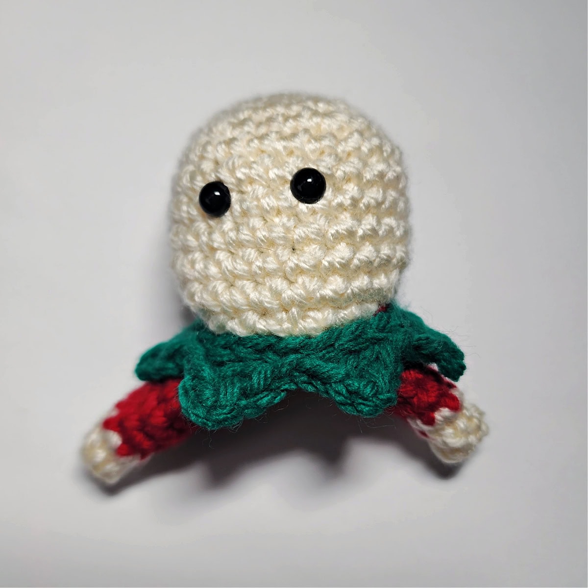 Where to attach safety eyes for your girl elf crochet ornament.