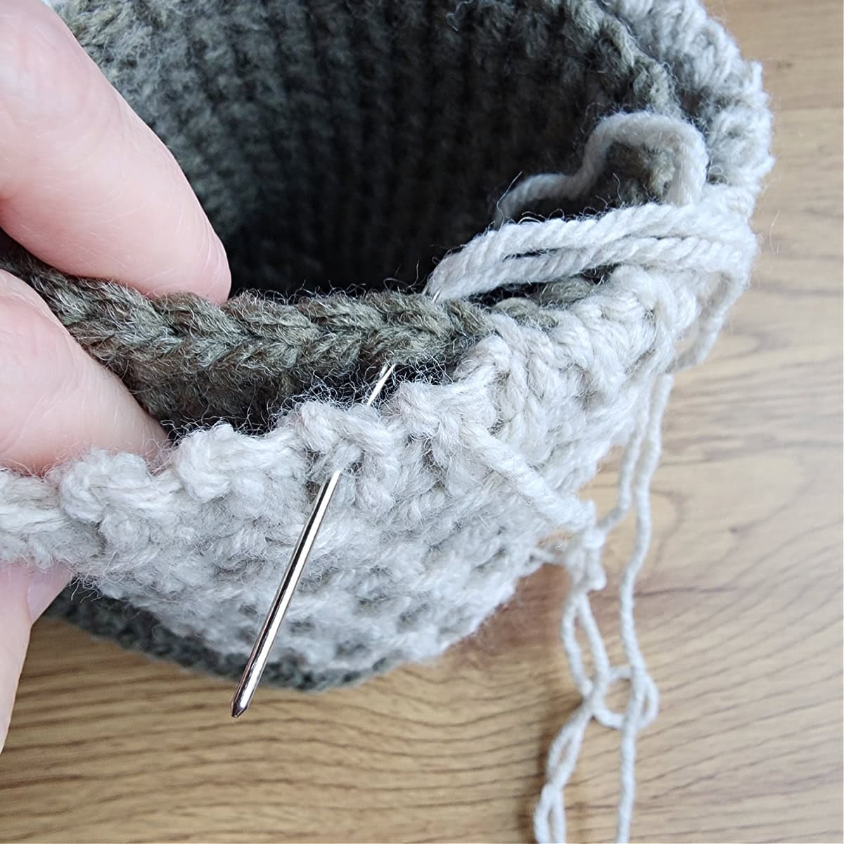 I only whipstitched the slip stitch rows of the cuff to the stitches around the ankle opening.