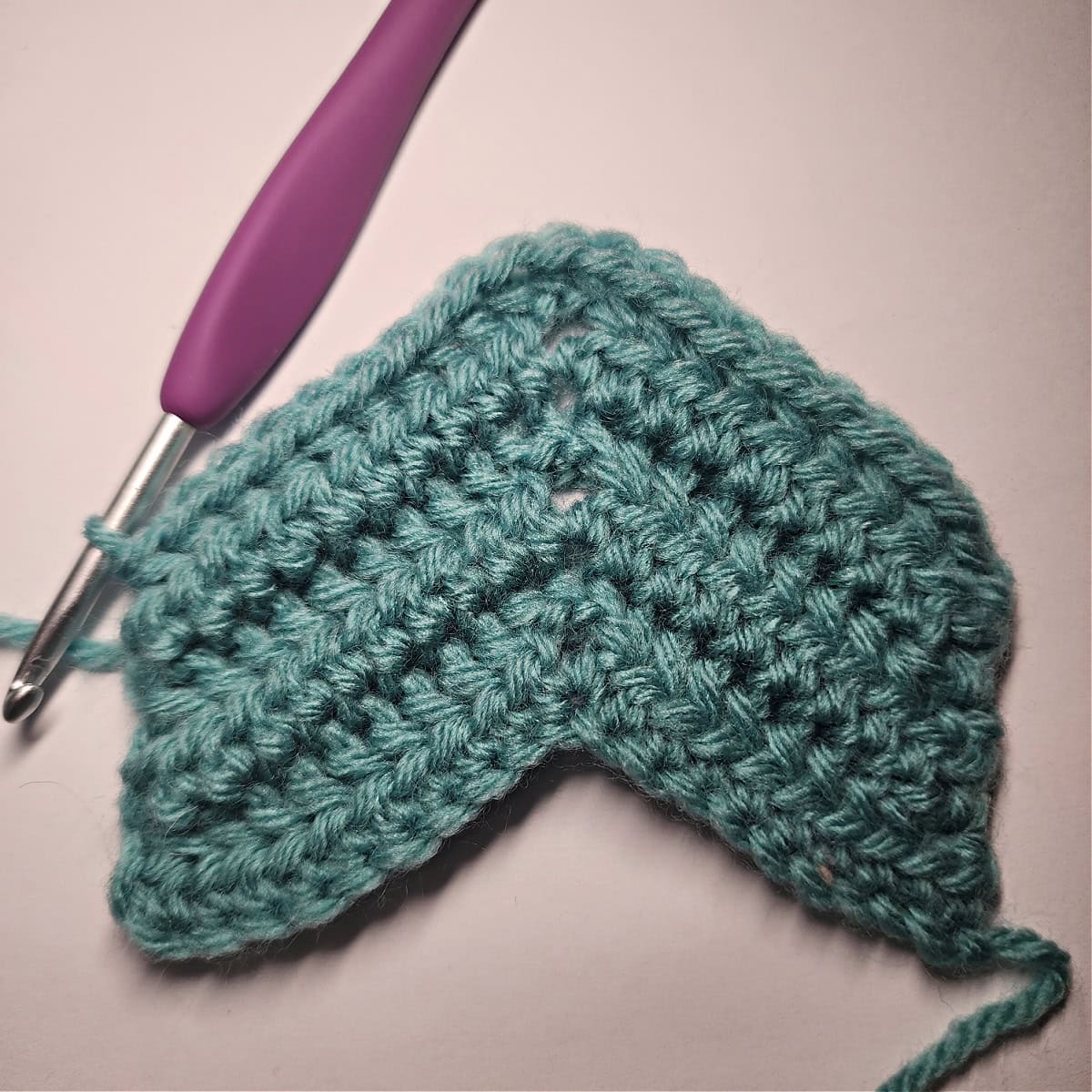 Six rows of the crochet ear warmer pattern complete.