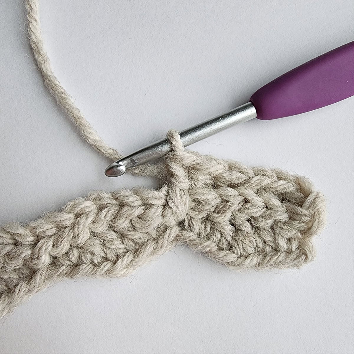 A long double crochet completed in the mock smock crochet stitch pattern.