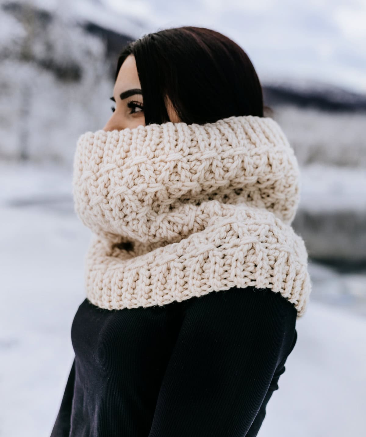 Close up of a crochet cowl made in a chunky yarn.