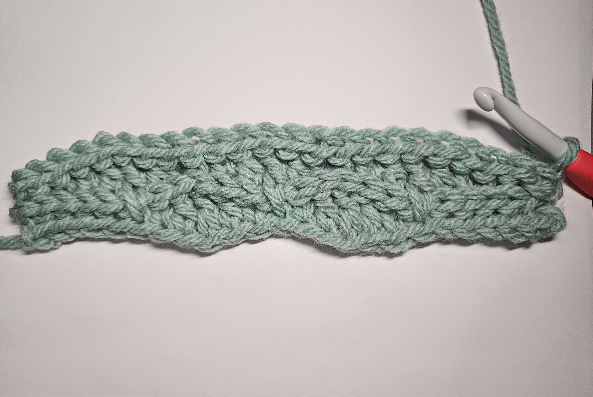 This photo shows the right side of the crochet beanie and the first short row sections complete.