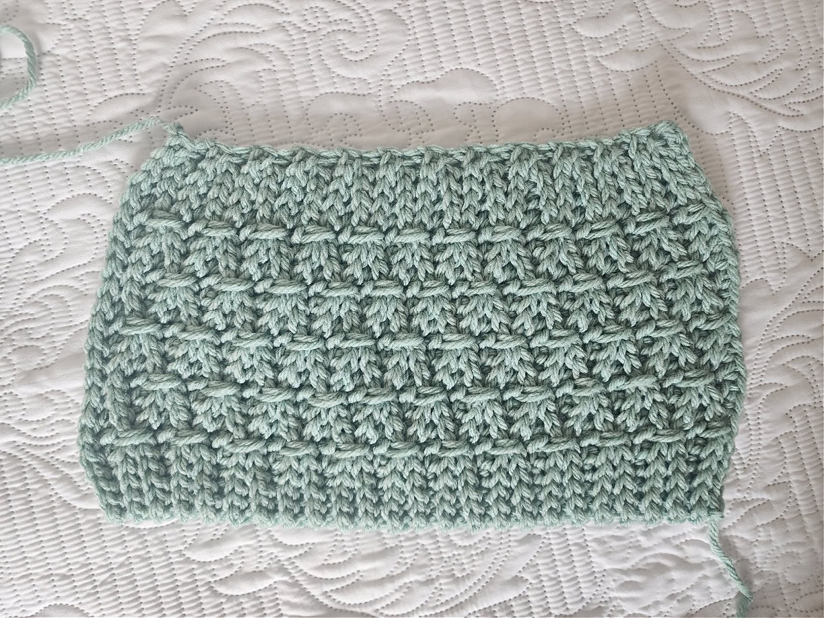 This photo shows the crochet hat pattern before it is seamed.