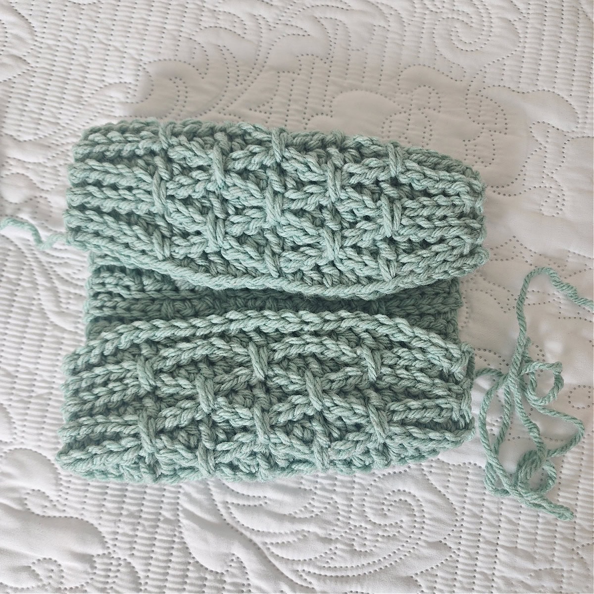 Photo shows the first and last rows folded up to meet so the hat can be seamed.