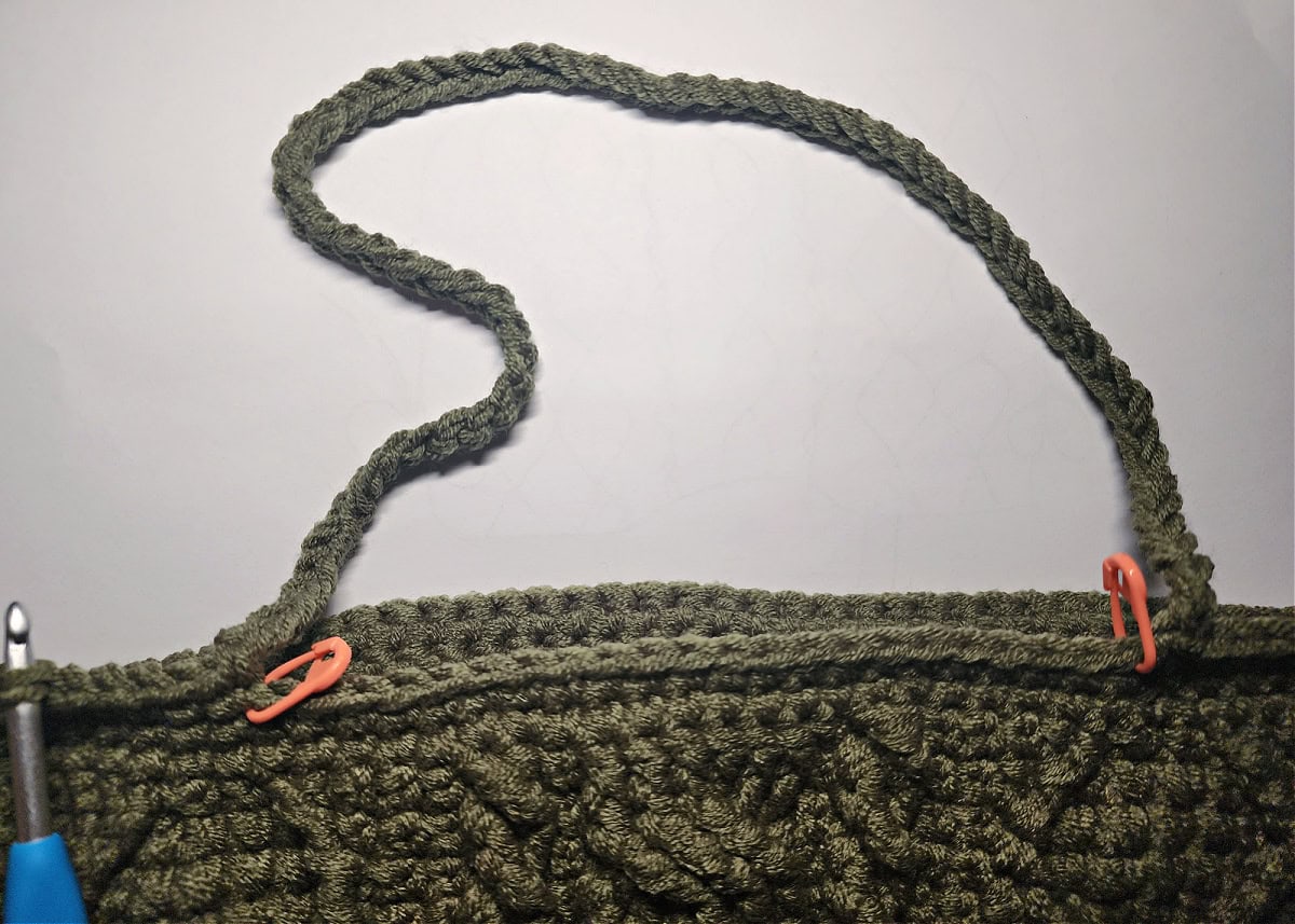 A crochet chain long enough to create a strap for a purse.