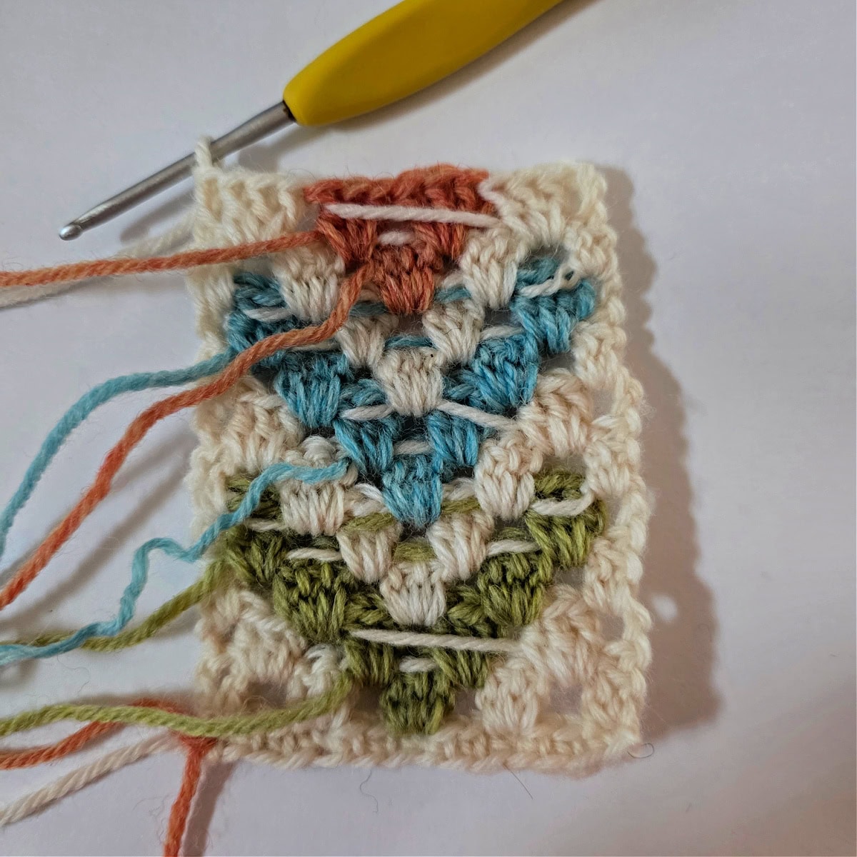 Intarsia crochet techniques for colorwork using the granny stitch.