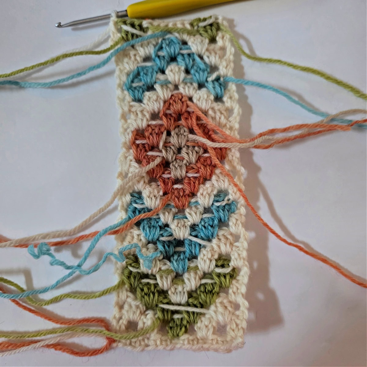 A crochet motif using intarsia crochet to create a picture in the granny stitch.