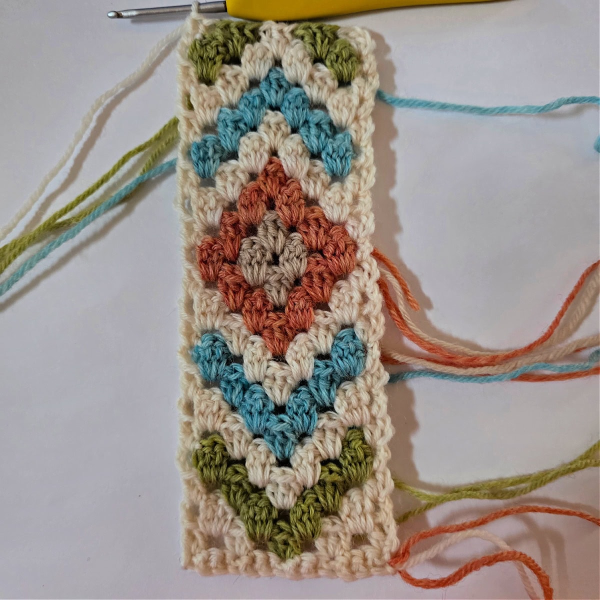 The beginning of a crochet motif for a crochet triangular scarf.