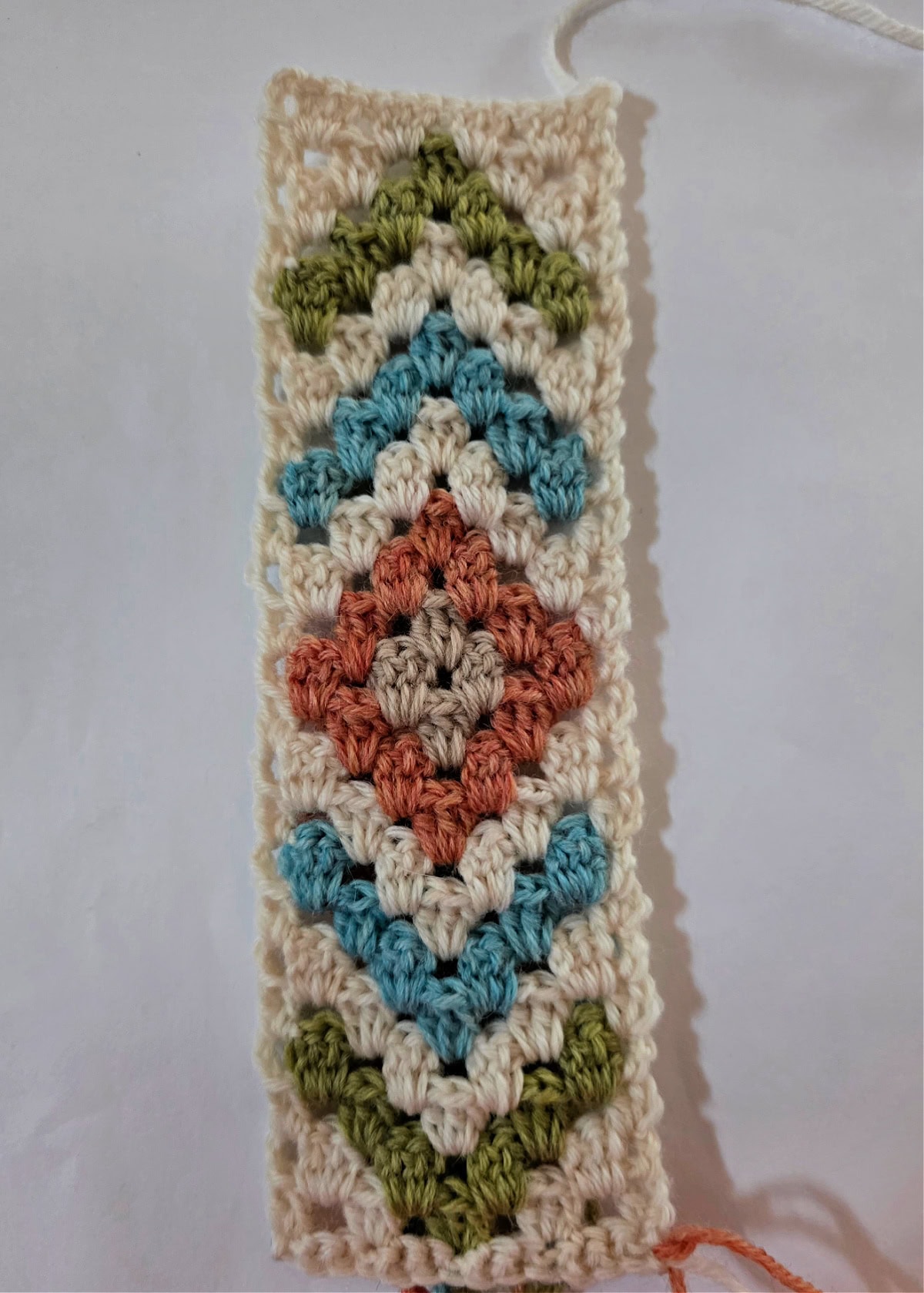 This photo shows the right side of one full repeat of the colorwork chart for the boho scarf.