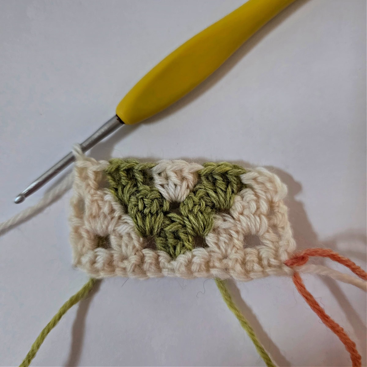 A 2.75mm crochet hook and small swatch of granny stitch diamonds.