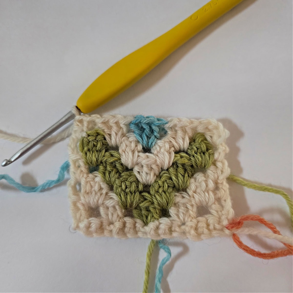 The right side of a small granny stitch colorwork swatch.